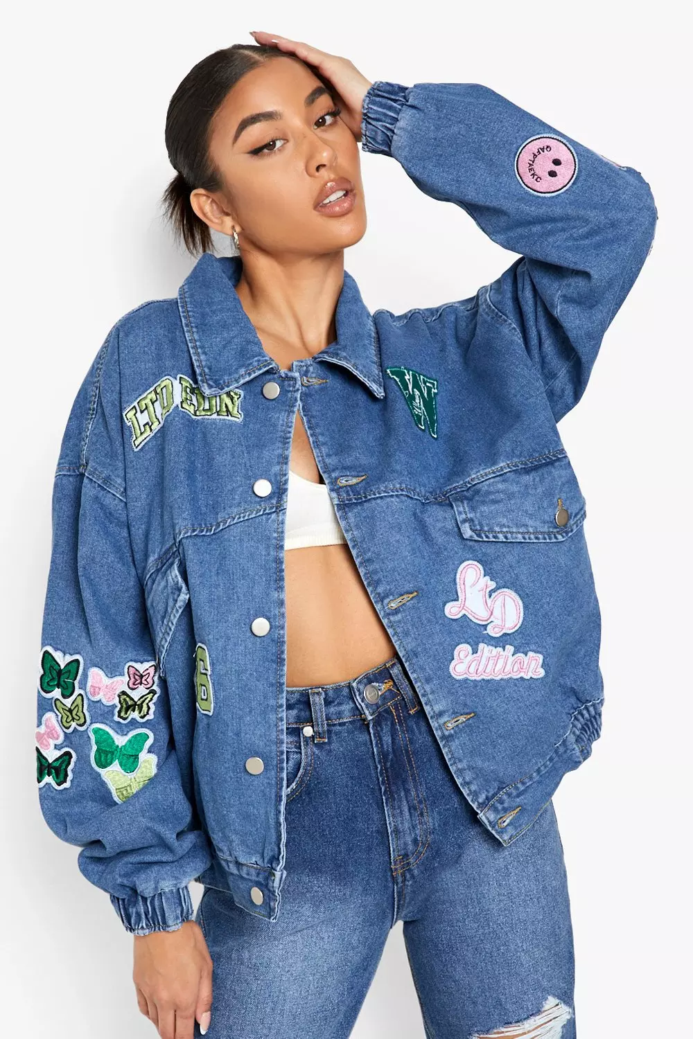 Denim jacket with store badges